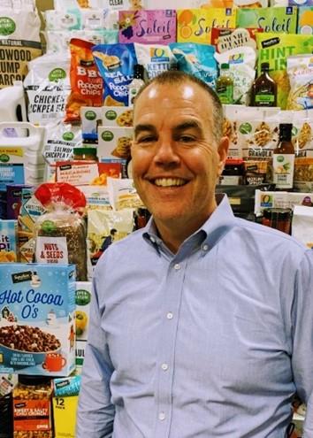 a man standing in front of a store