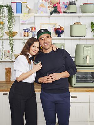 Shae Hong et al. standing in a kitchen