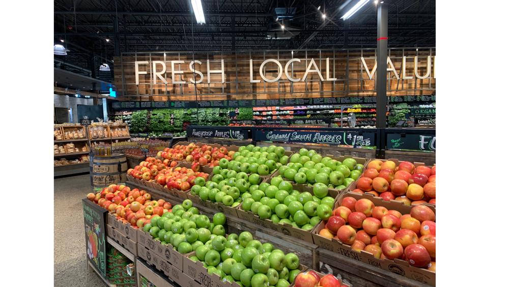 a variety of fruits and vegetables on display in a store