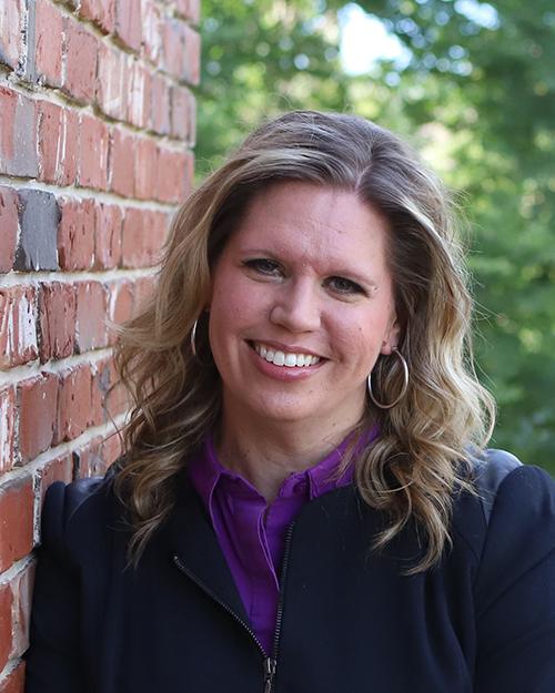 a woman smiling for the camera