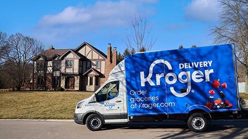 a delivery van outside a home