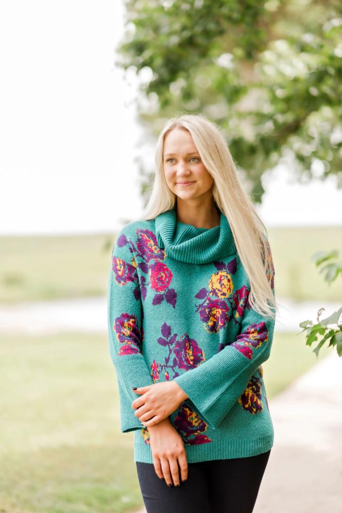 a woman wearing a green shirt